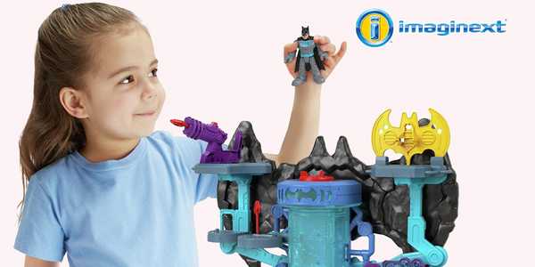 A girl playing with Imaginext DC super friends.